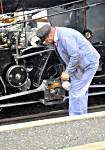Photo of driver oiling the Rigi Bahn steam loco.