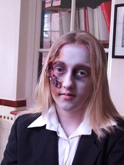 Member of the cast in make-up.