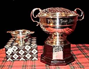 Photo of the two prizes, a rose-bowl and a quaich.