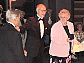 Val Ellis collects medal for 'Unlocking Young Minds'.
