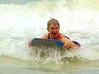 Linda Gough on a surfboard.