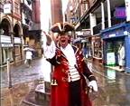 Opening shot of town crier.