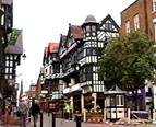 A street in Chester with half-timbered buildings.