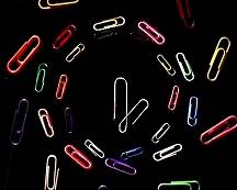 Coloured paperclips in a spiral formation.