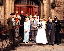 The wedding group on church steps in 'Someone For Life'.