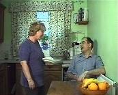 'Muriel' and 'Keith' in the kitchen talking.