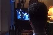 Boy watches dummy 'Psycho' on tv.