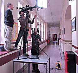 The camera crew shooting the school bell.